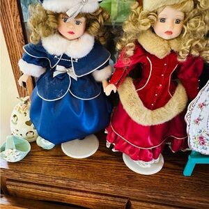 Unk Porcelain Dolls in Blue and Red Dresses